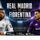 Real Madrid vs Fiorentina players battling for the ball during a floodlit football match preview in a packed stadium.